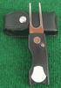  The Golf Divot Tool has white plastic flake which could be substituted for the sweeping golf ball to mark position.